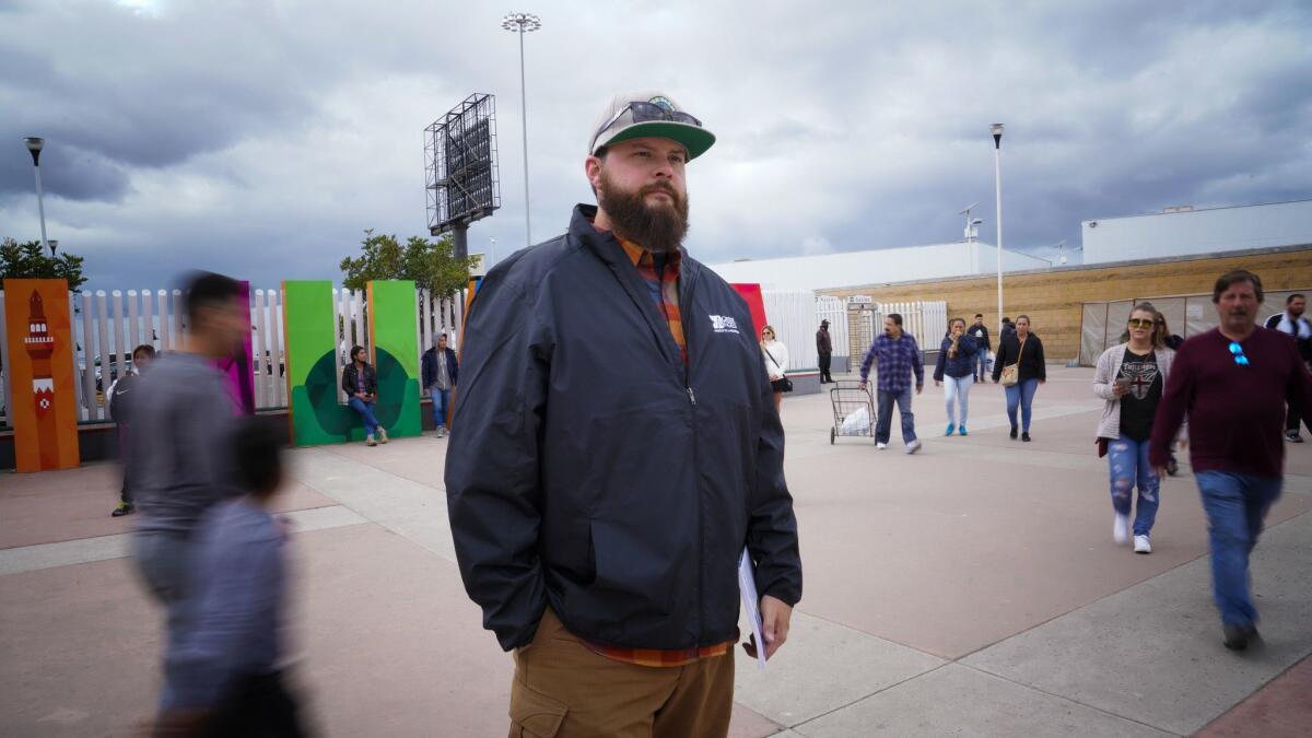 James Cordero stands at the entrance to the port of entry at El Chaparral in Mexico. On two separate occasions, Cordero has been delayed at the U.S. port of entry and taken into Customs and Border Protection's secondary inspection.