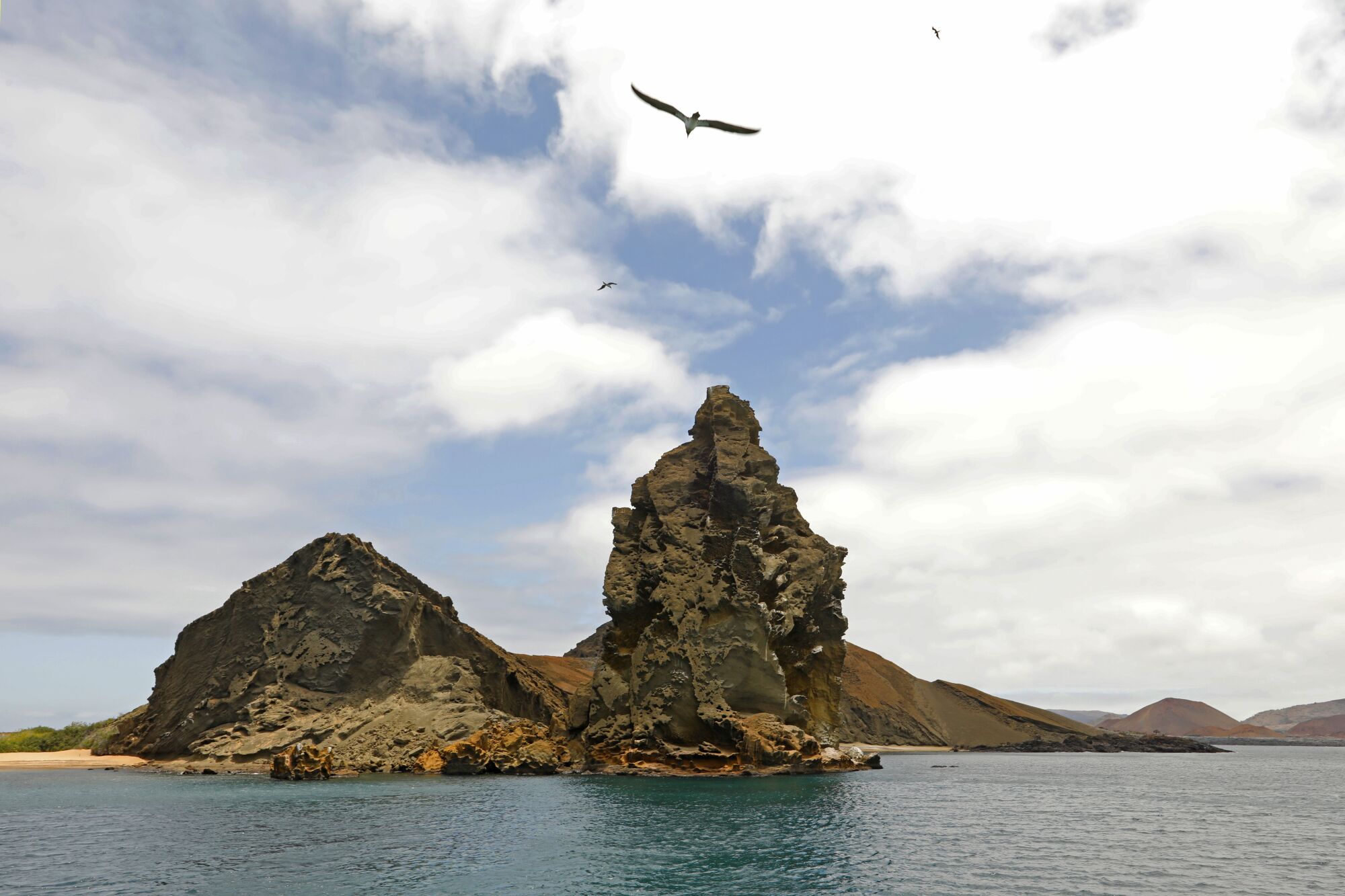 Pinnacle Rock is a celebrated volcanic plug on Bartholomew Island, one of Ecuador's Galapagos Islands.