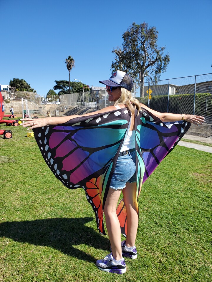 Bird Rock Elementary School parent Kimberly Spear flaps her butterfly wings during the Bird Rock Foundation's Fall Festival.