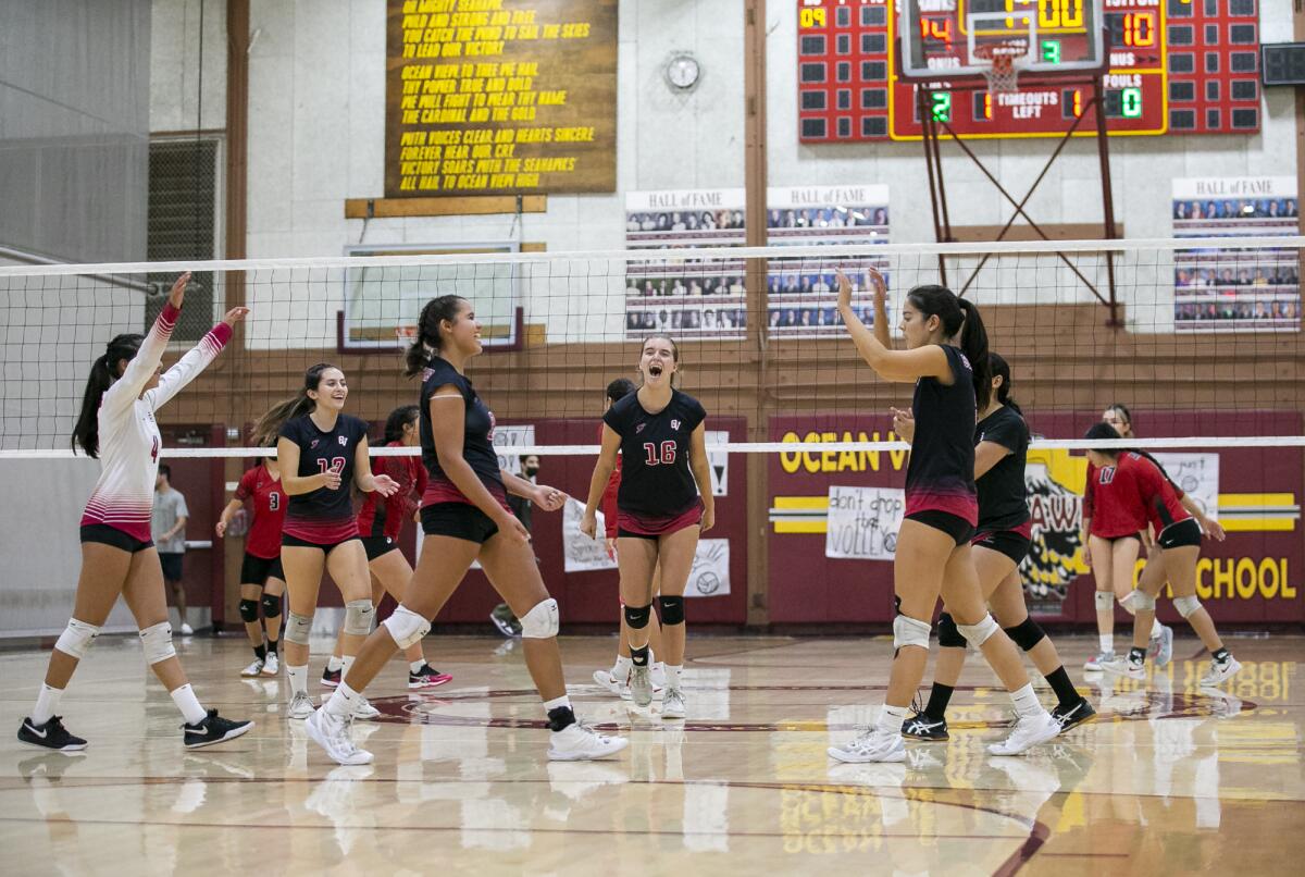 Ocean View celebrates after sweeping Katella in a Golden West League girls' volleyball game on Thursday.