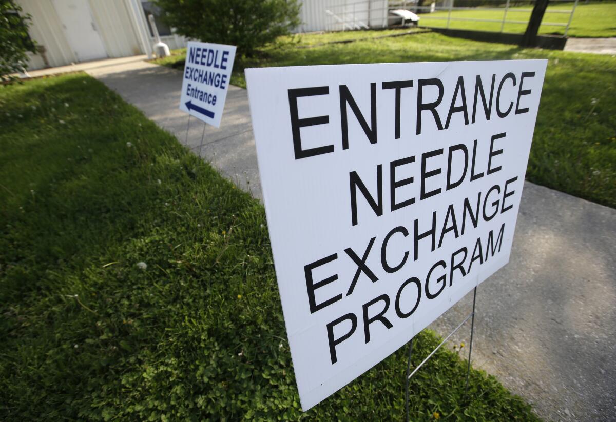 A sign in Indiana points to a needle exchange program entrance