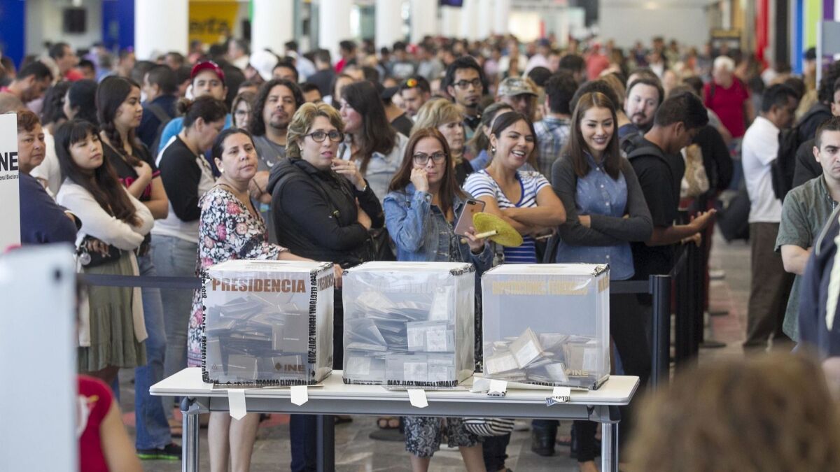 Residents of southern California were among the hundreds waiting to vote for president on Sunday at a special polling station set up at the Tijuana airport for voters in transit.