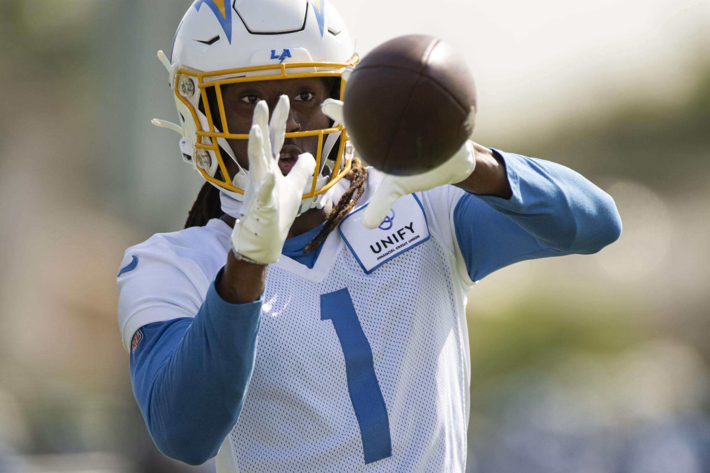 Chargers wide receiver Quentin Johnston catches a pass at training camp in July.