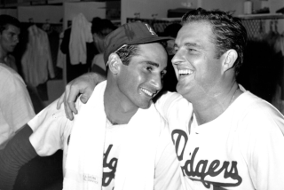 Pitchers Don Drysdale (53) and Sandy Koufax share a laugh in the locker room at Dodger Stadium