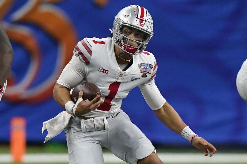 Ohio State quarterback Justin Fields runs against Clemson during the first half of the Sugar Bowl.