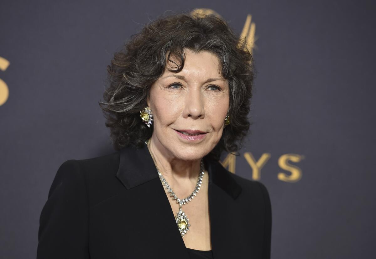 FILE - Lily Tomlin appears at the 69th Primetime Emmy Awards in Los Angeles on Sept. 17, 2017. Tomlin is this year's recipient of AARP The Magazine’s Movies for Grownups® Awards Career Achievement Award. The 20th anniversary virtual event, hosted by Alan Cumming, will be telecast on “Great Performances” on PBS on March 18 . (Photo by Jordan Strauss/Invision/AP, File)