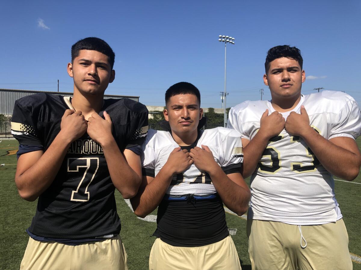 Undefeated Marquez (5-0) has been led by three seniors (from left): quarterback Erick Salas, linebacker Christopher Diego and lineman Aldo Sanchez.