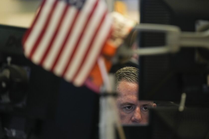 Traders work on the floor at the New York Stock Exchange in New York, Friday, June 2, 2023. (AP Photo/Seth Wenig)