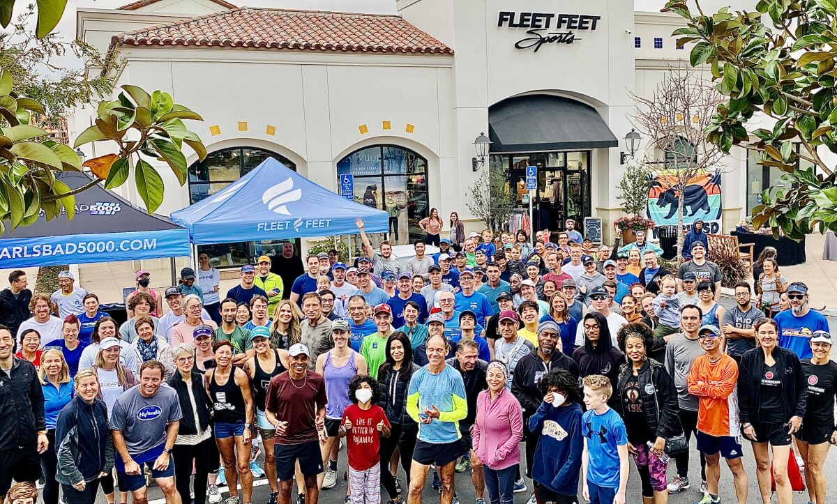 Meb Keflezighi, front in marroon, joined Fleet Feet's weekly run group.