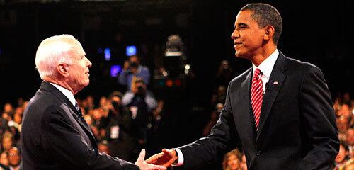 John McCain and Barack Obama greet each other at the start of the debate.