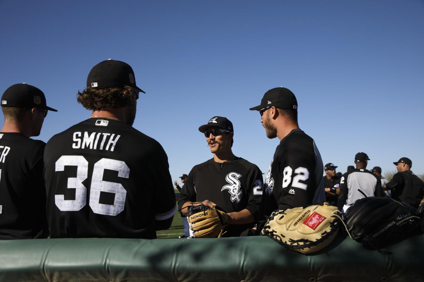 Tyler Saladino, second from right, talks with teammates on Feb. 23, 2017, in Glendale, Ariz.