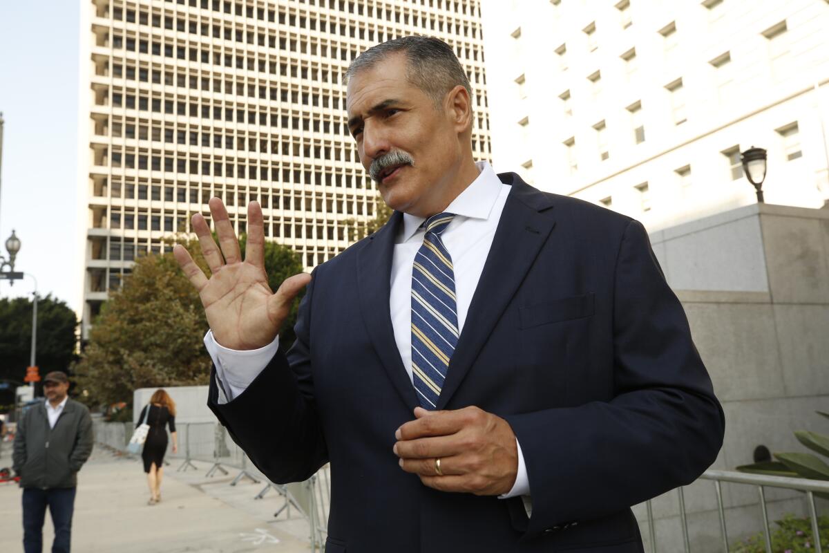 Los Angeles County Sheriff's commander Eli Vera held a press conference in front of the Hall of Justice 