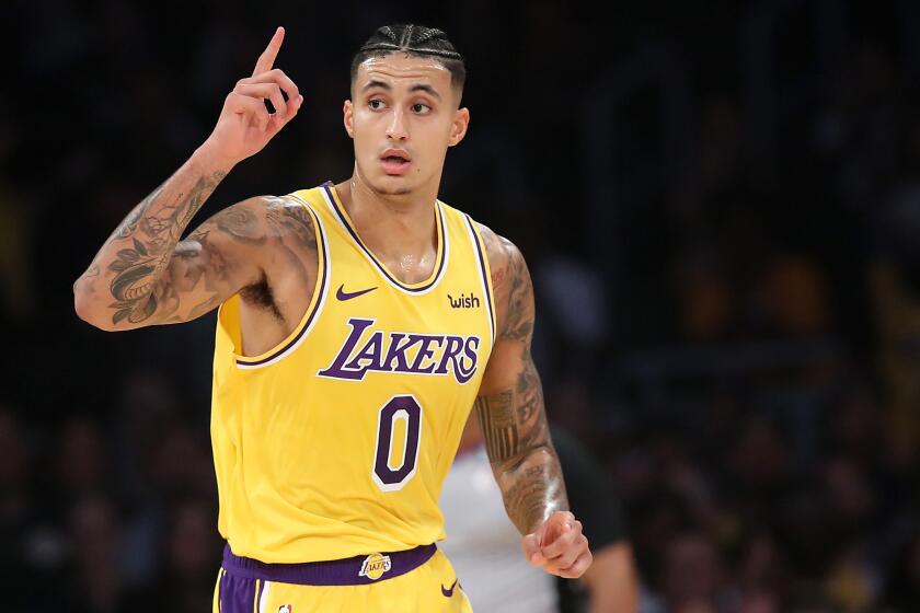 Kyle Kuzma  after making a three-point shot against the Oklahoma City Thunder at Staples Center on November 19, 2019.