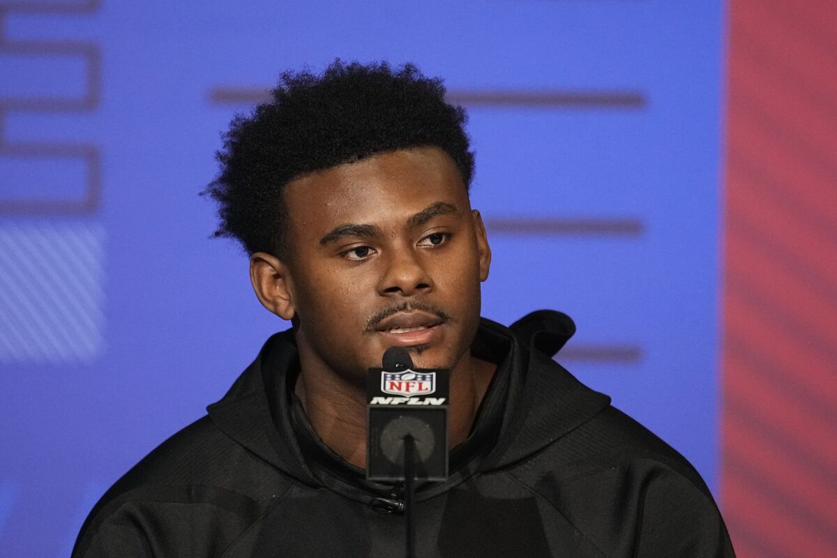 Liberty quarterback Malik Willis speaks during a press conference at the NFL football scouting combine, Wednesday, March 2, 2022, in Indianapolis. (AP Photo/Darron Cummings)