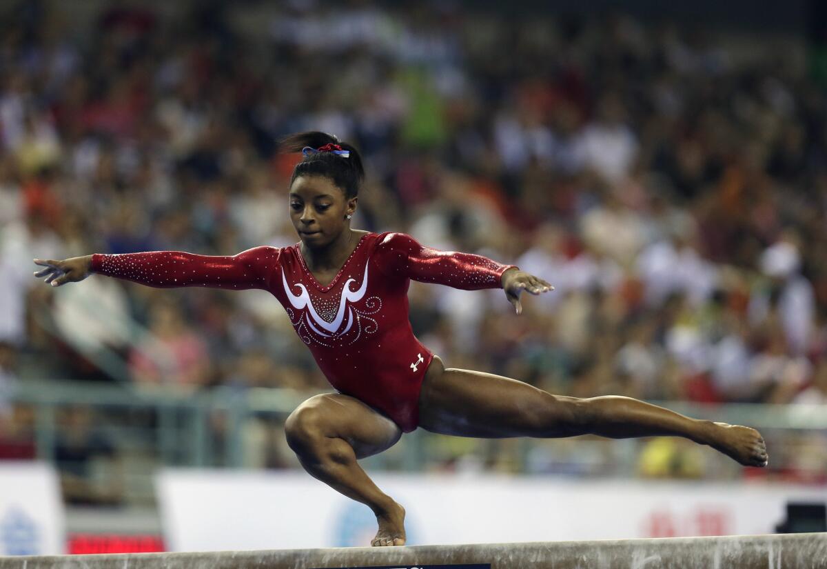 U.S. gymnast Simone Biles performs on the balance beam during the women's team final at the world championships in Nanning, China.