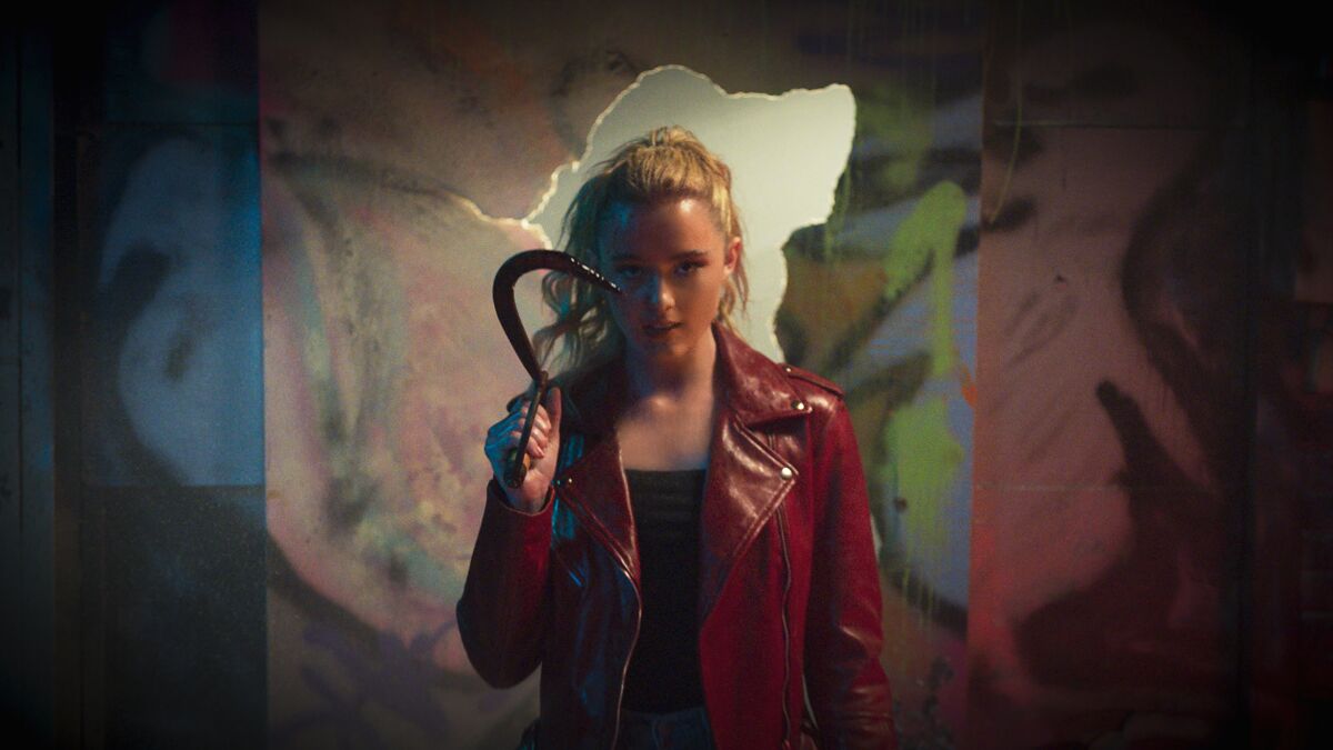 Kathryn Newton holds a weapon as a serial killer in "Freaky."