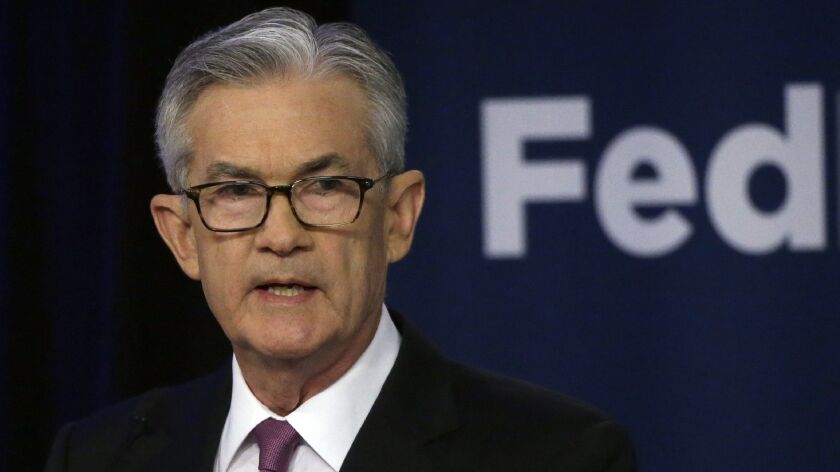 Federal Reserve Chairman Jerome Powell discusses interest rate policies at a conference in Chicago.