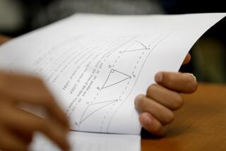 LOS ANGELES, CALIFORNIA--AUG. 29, 2019--At Roybal Learning Center in Los Angeles, Robert Montgomery teaches a "transition to college math and statistics" class to 12th graders.The course, developed in partnership with the CSU, includes review of essential math skills. (Carolyn Cole/Los Angeles Times)