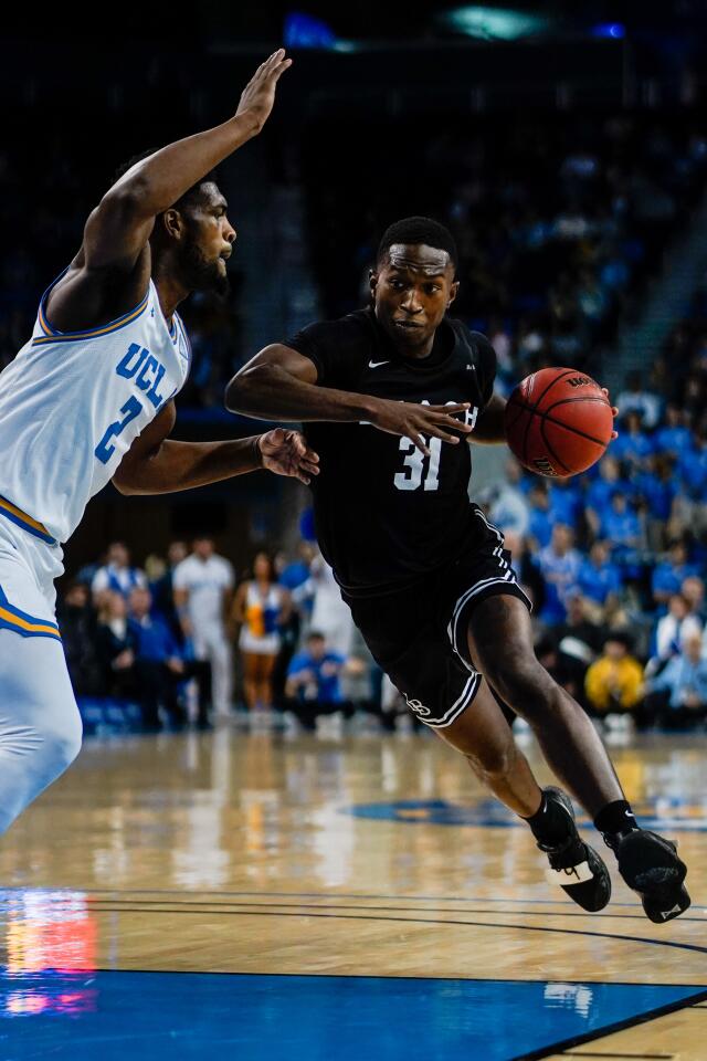 Long Beach State guard Chance Hunter (31) drives to the basket during the first half of a game against UCLA on Nov. 6 at Pauley Pavilion.