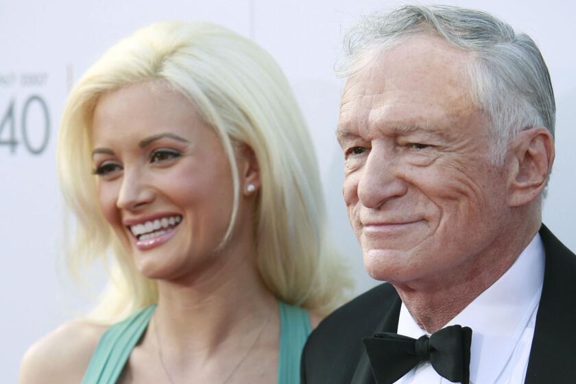 Holly Madison and Hugh Hefner arrive at an event June 7, 2007