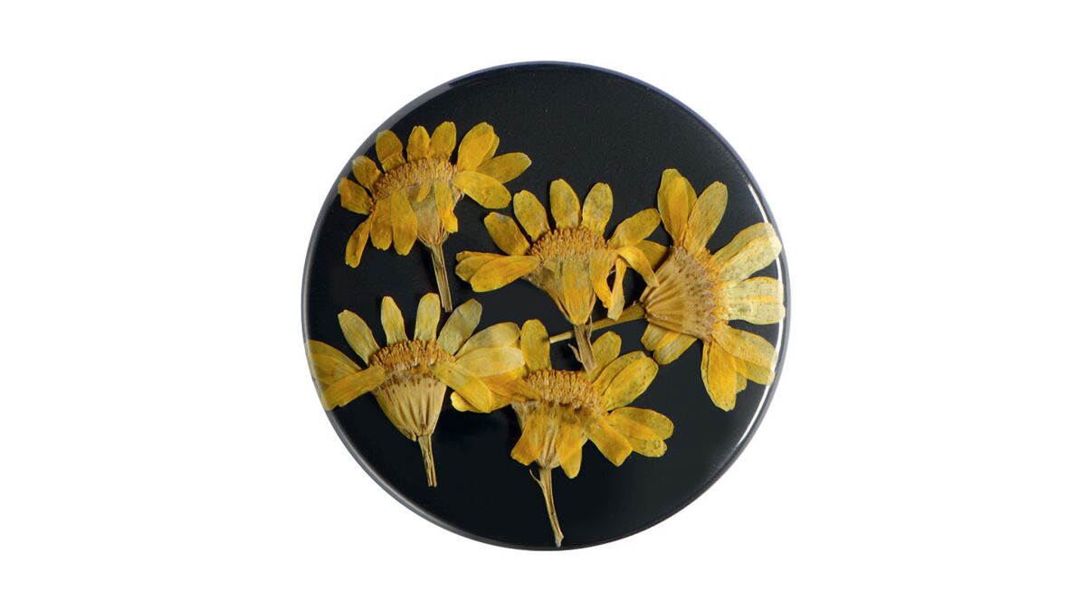 Dior Homme natural dried flower pin with palladium finish, available in 14 styles, price upon request at Dior Homme in Beverly Hills, (310) 247-8003, diorhomme.com.