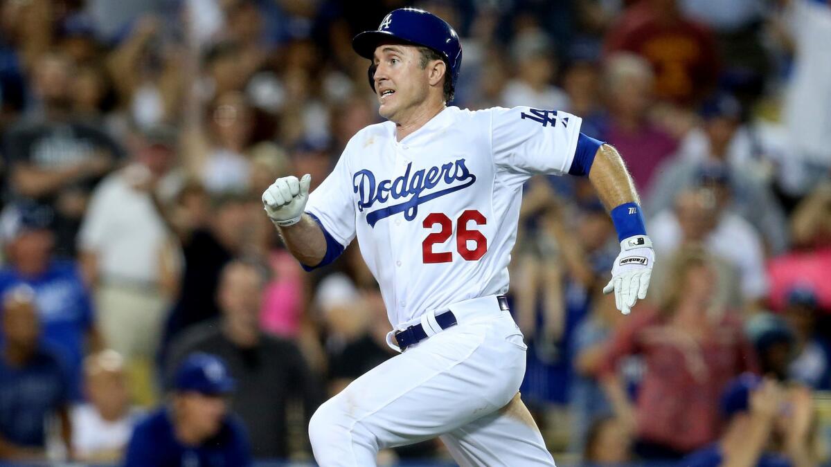 Dodgers second baseman Chase Utley scores Friday night on a throwing error by catcher Miguel Montero in the sixth inning.