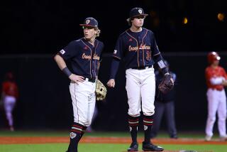 Nolan Tillett (right) picked up the save for Orange Lutheran on Tuesday in a 4-1 Trinity League win over JSerra.