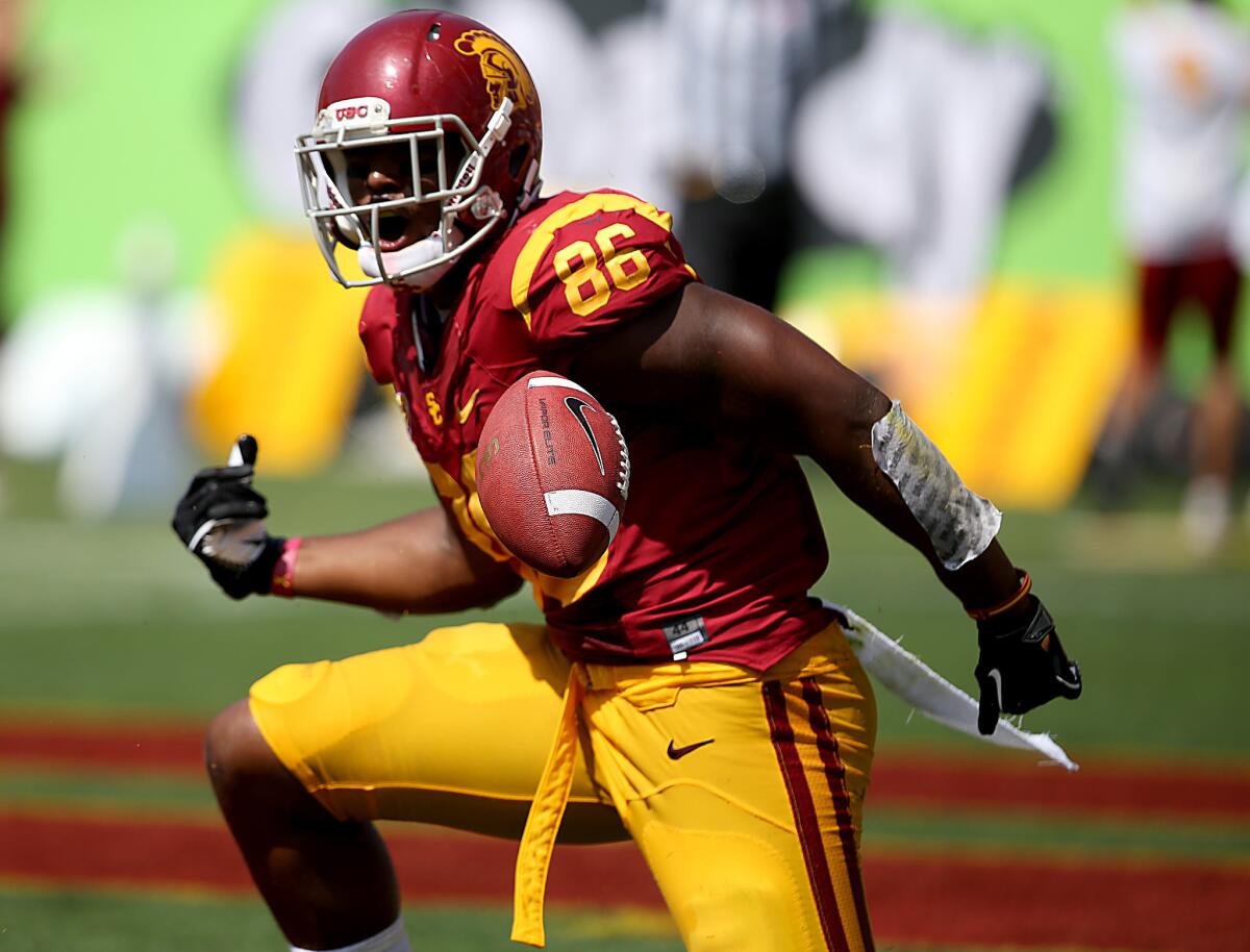 Tight end Xavier Grimble is leaning toward staying with USC.