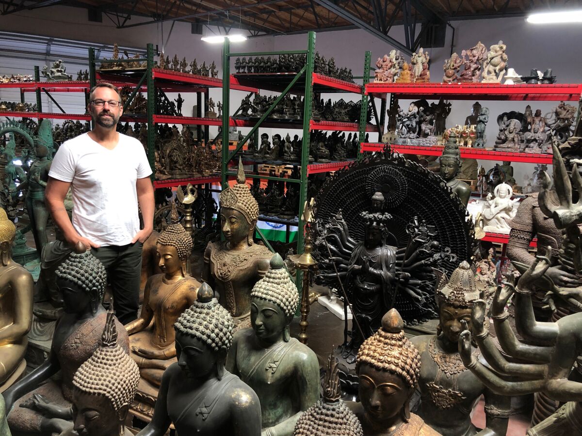 Encinitas resident Kyle Tortora has more than 1,000 Buddhist and Hindu statues in his Oceanside warehouse.