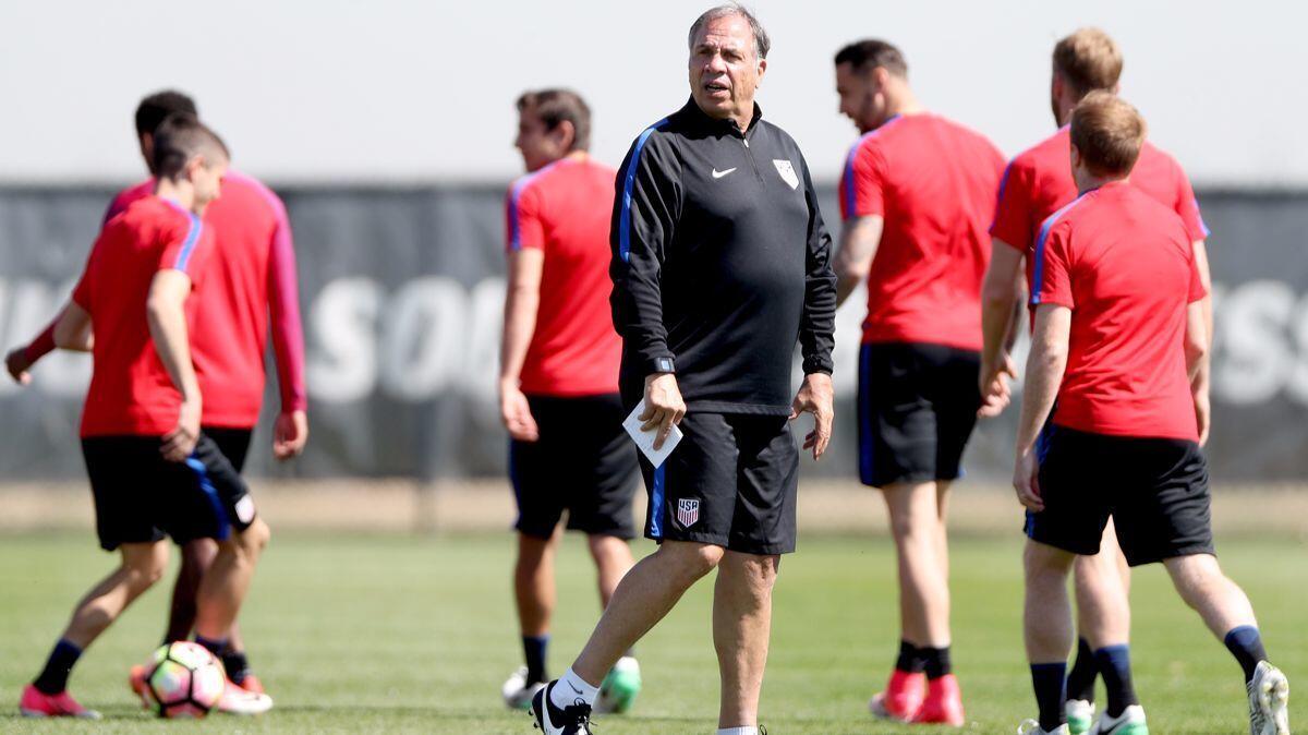 Coach Bruce Arena walks on the pitch at the beginning of a training session of the U.S. men's national team at Dick's Sporting Goods Park on May 31 in Commerce City, Colo.