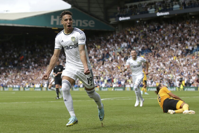 Leeds United's Rodrigo Moreno celebrates scoring their side's first goal of the game during the English Premier League soccer match between Leeds United and Wolverhampton Wanderers, at the Elland Road in Leeds, England, Saturday, Aug. 6, 2022. (Ian Hodgson/PA via AP)