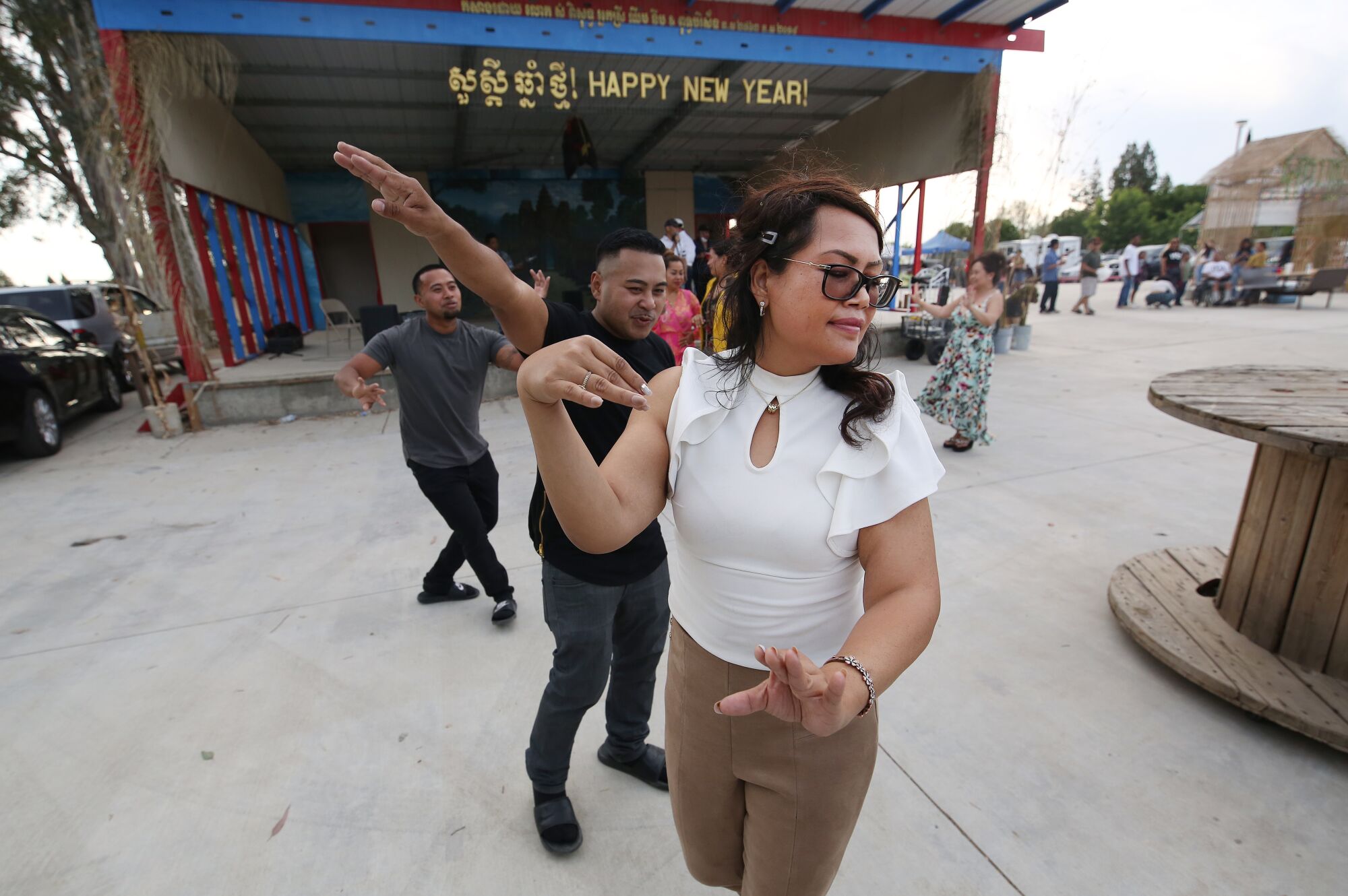 Sila Khoun and Somaley Nuon dance to the beat at the Cambodian Night Market in Fresno.