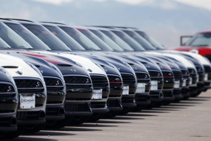 FILE - A line of unsold 2018 Cooper Clubmen sit in a long row at a Mini dealership, March 30, 2018, in Highlands Ranch, Colo. Lawmakers on Capitol Hill are pushing to keep AM radio in the nation's cars. A bipartisan group in Congress on Wednesday, May 17, 2023, introduced the “AM for Every Vehicle Act." The bill calls on the National Highway Traffic Safety Administration to require automakers to keep AM radio in new cars at no additional cost. (AP Photo/David Zalubowski, File)