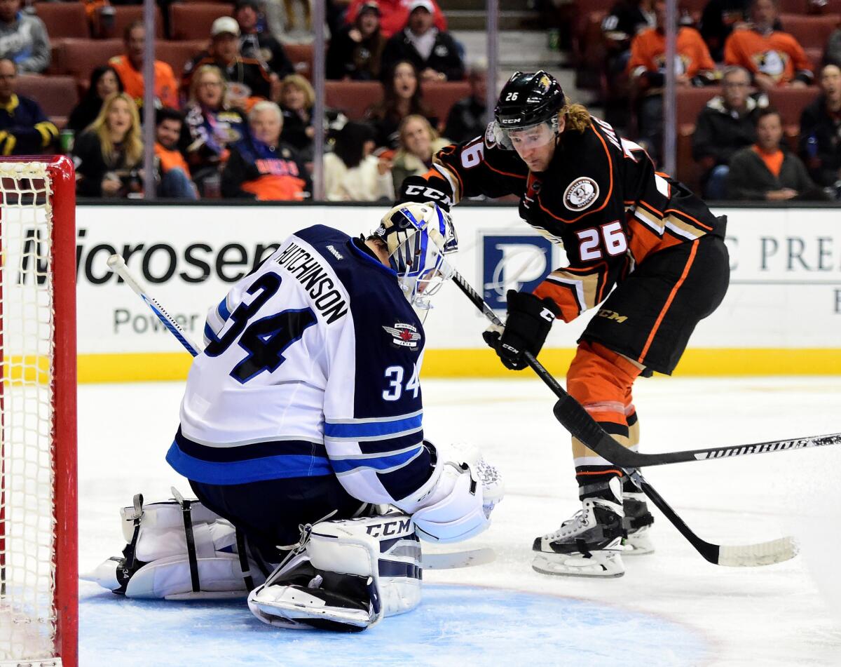 Michael Hutchinson of the Winnipeg Jets stops Ducks forward Carl Hagelin during the third period of a game on Jan. 3.