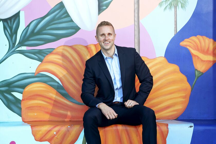 Scott Mikelonis, 36, is the new chief executive of the Costa Mesa Chamber of Commerce. Costa Mesa's official motto is "City of the Arts.O (Kevin Chang / Daily Pilot)