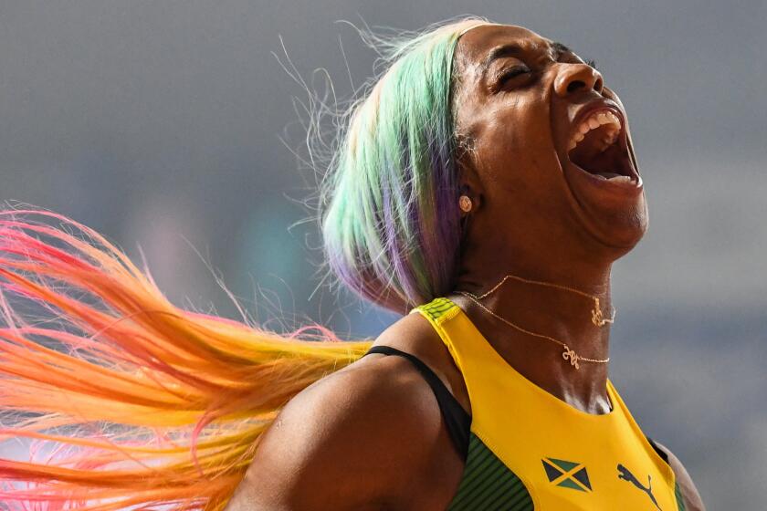 Jamaica's Shelly-Ann Fraser-Pryce celebrates after winning the Women's 100m final at the 2019 IAAF World Athletics Championships at the Khalifa International Stadium in Doha on September 29, 2019. (Photo by Jewel SAMAD / AFP) (Photo credit should read JEWEL SAMAD/AFP/Getty Images)