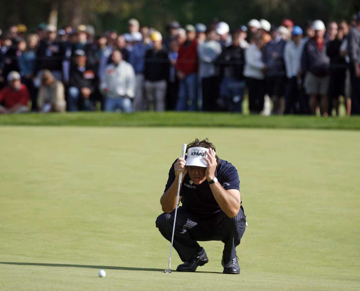 Phil Mickelson tries to find the line for a putt during the final round of the Northern Trust Open at Riviera Country Club last year.