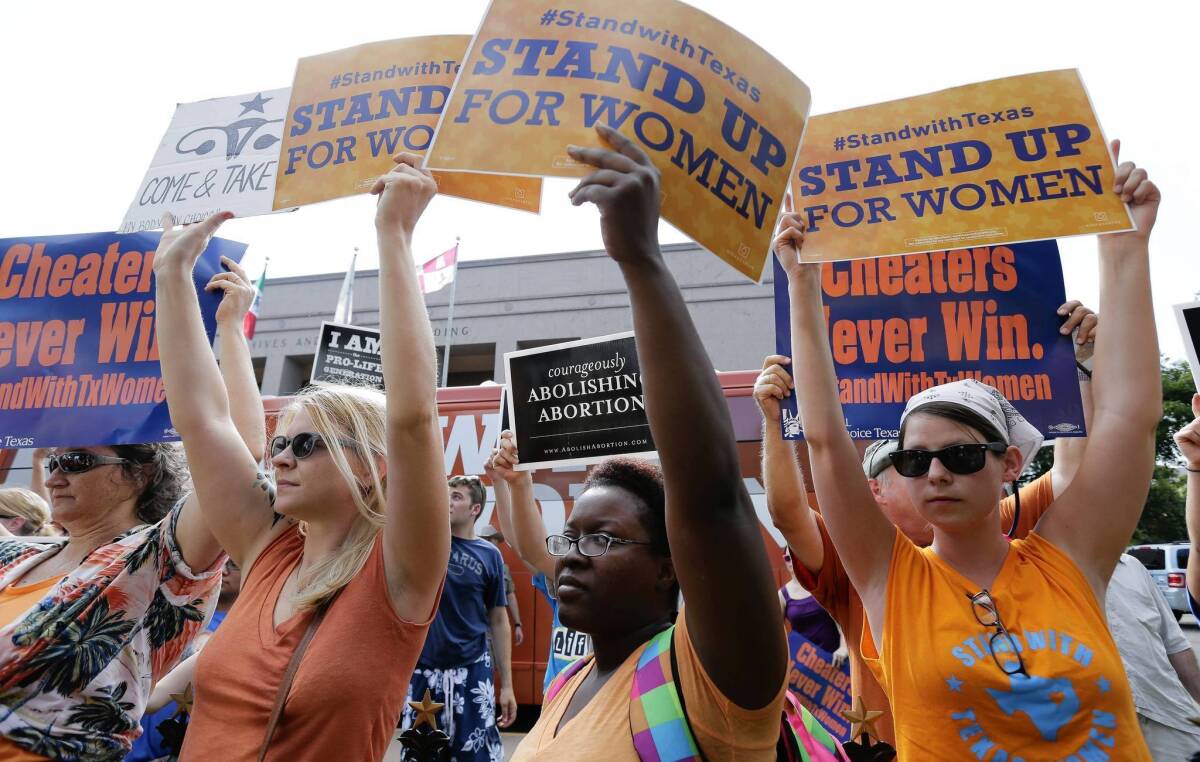 Opponents and supporters of abortion restrictions demonstrate at the Texas Capitol in Austin in July.