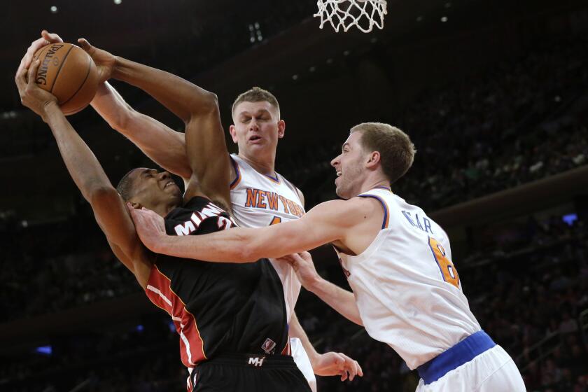 New York Knicks center Cole Aldrich wraps his hand over a shot by Miami's Hassan Whiteside in a Feb. 20 game.
