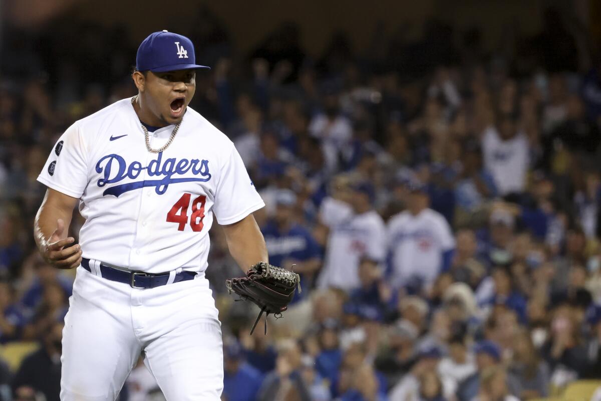 Dodgers relief pitcher Brusdar Graterol celebrates after an out during the fifth inning.