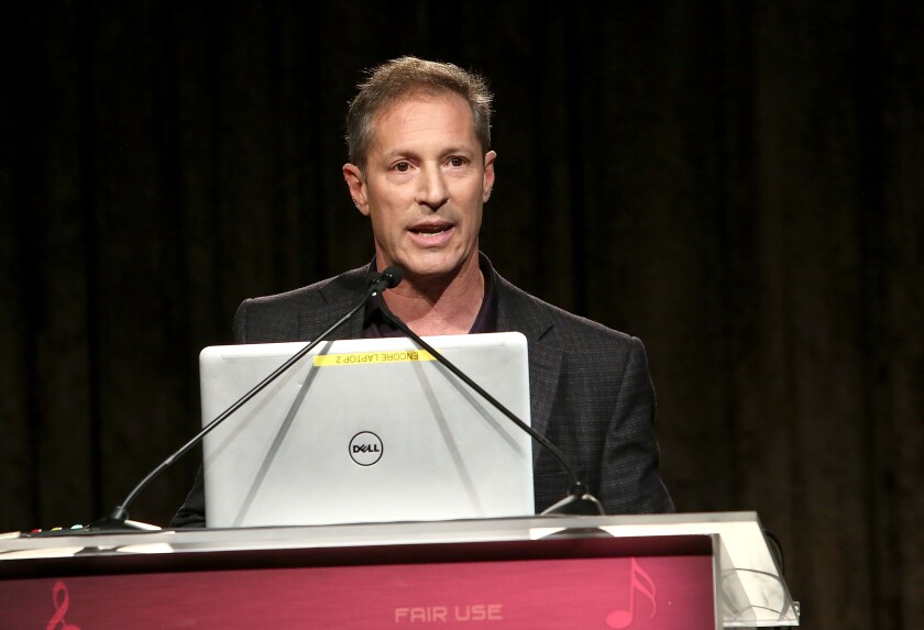 Marc Geiger at a podium at the 59th GRAMMY Awards - Entertainment Law Initiative in Beverly Hills in February 2017