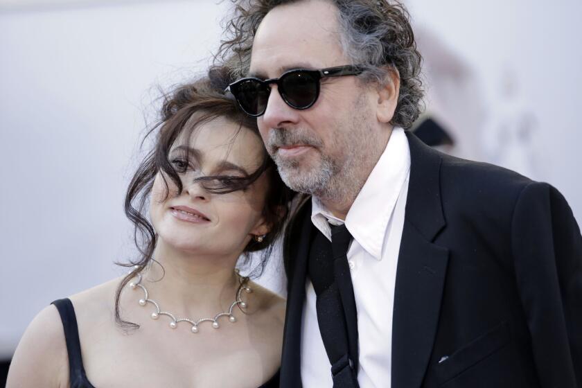Helena Bonham Carter and Tim Burton arrive at the Academy Awards ceremony on Feb. 24, 2013.