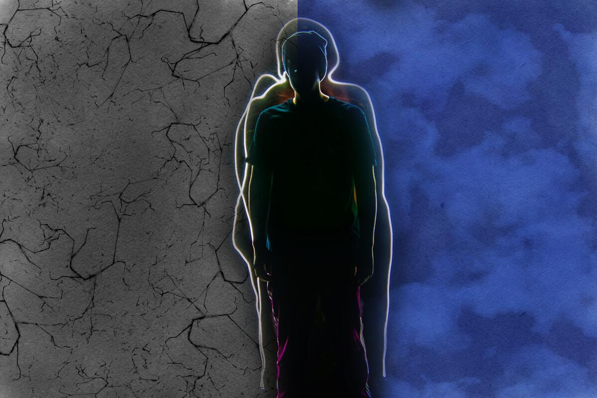 Silhouette of a person against a divided backdrop.