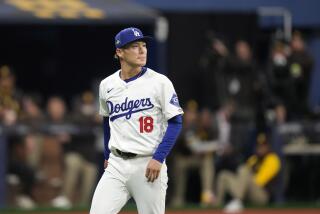 Los Angeles Dodgers starting pitcher Yoshinobu Yamamoto walks off the ties after Jackson Merrill struck out during the first inning of a baseball game at the Gocheok Sky Dome in Seoul, South Korea Thursday, March 21, 2024, in Seoul, South Korea. (AP Photo/Lee Jin-man)