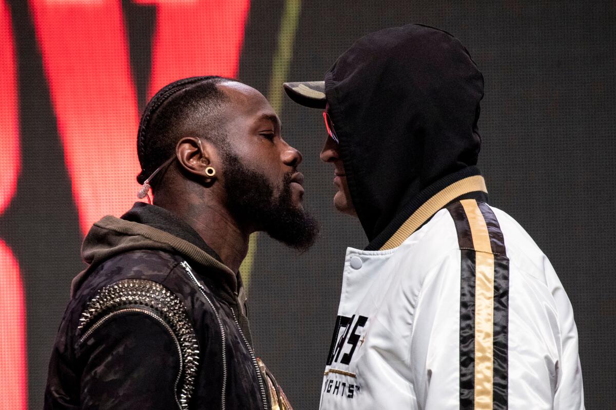 Deontay Wilder, left, and Tyson Fury face off on stage during their last press conference before their rematch for the WBC Heavyweight World Championship in Las Vegas on Wednesday.