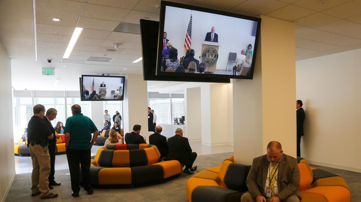 Federal employees and guests wait in the jury assembly room during opening ceremonies in the new U.S. district courthouse in downtown Los Angeles. (Mark Boster / Los Angeles Times)