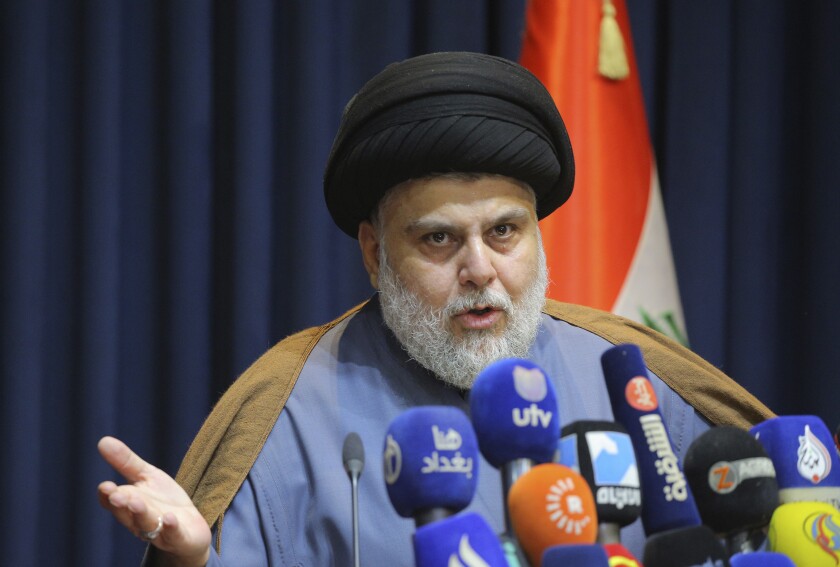 FILE - Populist Shiite cleric Muqtada al-Sadr, speaks during a press conference in Najaf, Iraq, Nov. 18, 2021. The final results announced by Iraq’s electoral commission on Tuesday, Nov. 30, 2021, confirmed al-Sadr as the biggest winner in last month's vote, securing 73 out of Parliament’s 329 seats. The results also confirmed that pro-Iran factions — which had alleged voter fraud — lost around two-thirds of their seats in the Oct. 10 elections. (AP Photo/Anmar Khalil, File)
