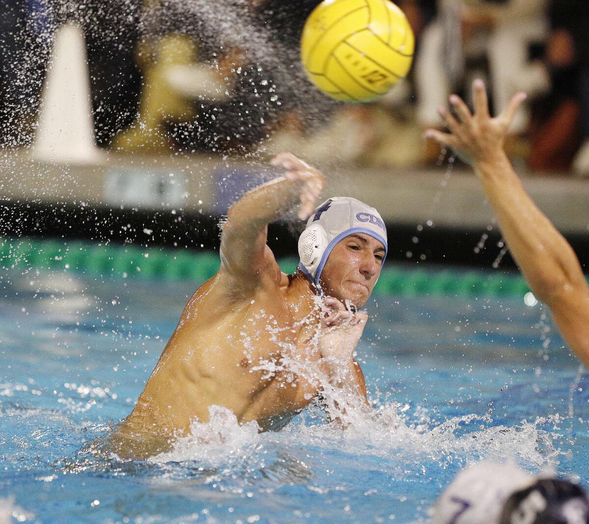 Tyler Harvey, shown shooting against Newport Harbor on Oct. 3, 2018, scored a team-best four goals for the Corona del Mar High boys' water polo team in the Long Beach Poly tournament title match on Saturday.
