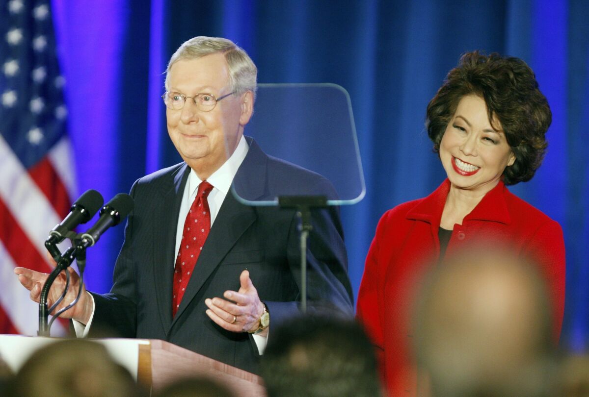 Senator Mitch McConnell (R-Ky.), speaks to supporters with his wife Elaine Chao during his victory celebration.