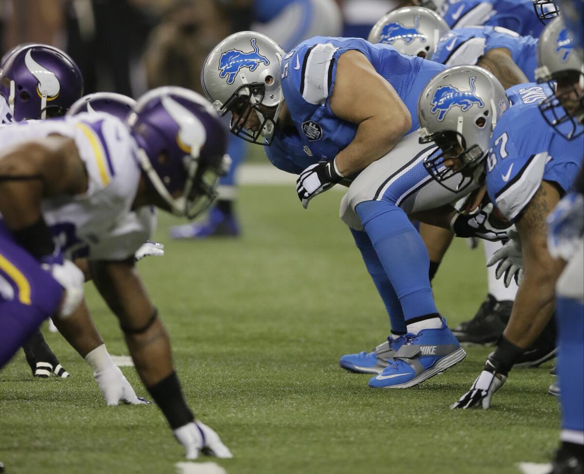 The Detroit Lions have an NFC North division title showdown with the Packers next week, but will they have center Dominic Raiola, pictured snapping the ball?